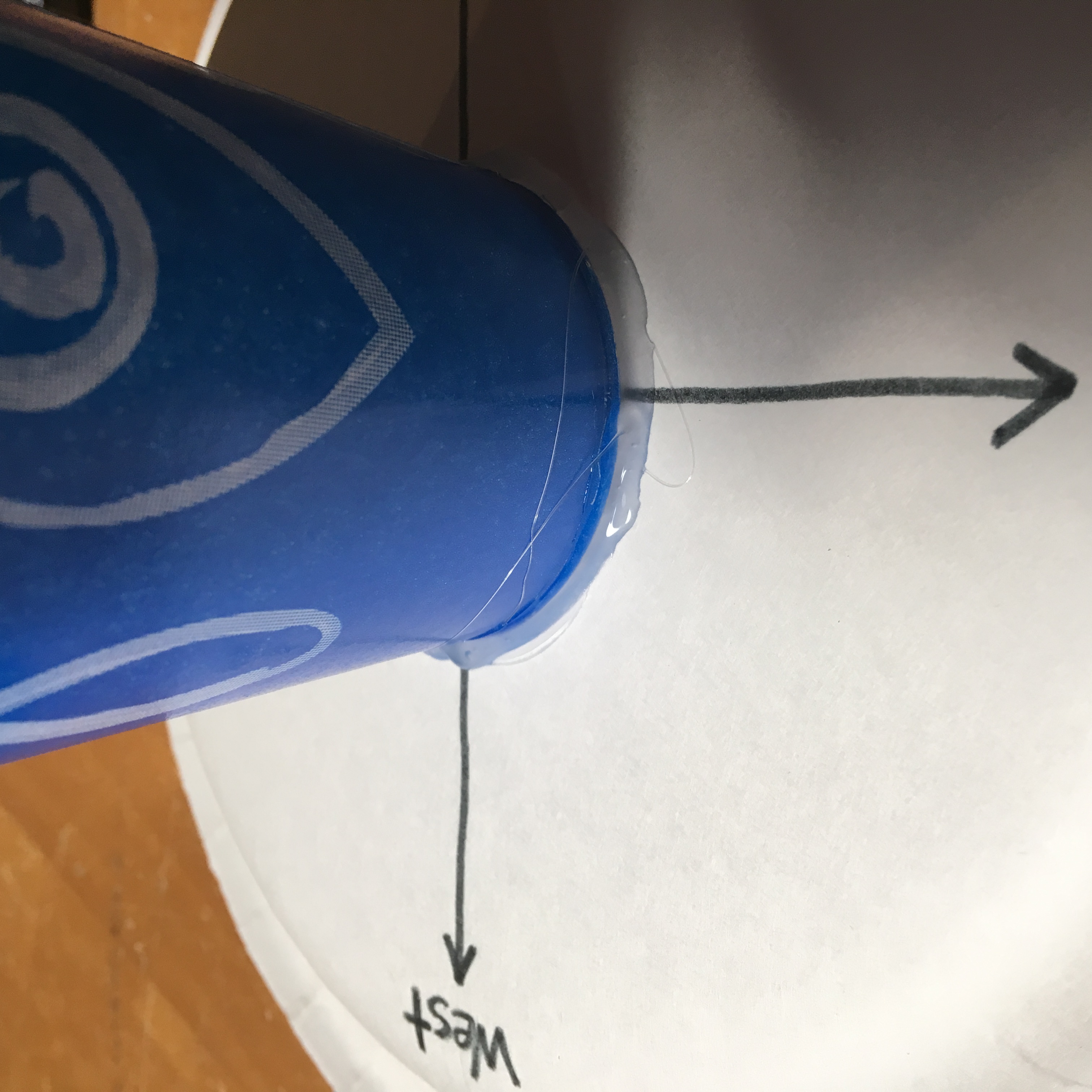 Hot glue the cup